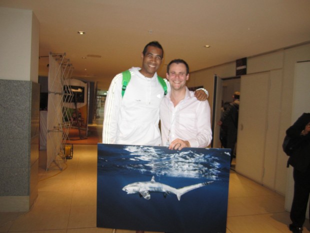 South African Olympic medalist, and great white shark attack survivor, Achmat Hassiem, recognising UK government (Jamie Rendell) as a ‘shark Champion’